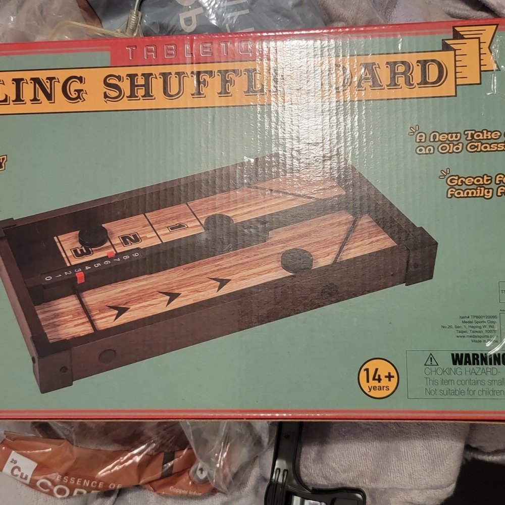 Sling shuffle board game